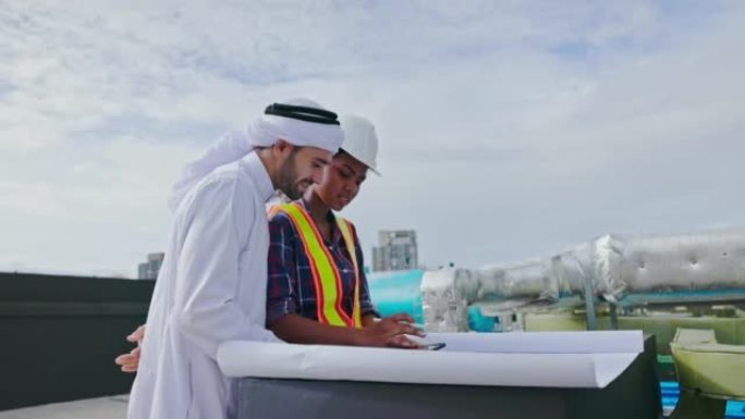 阿拉伯男工程师的4k录像与非洲裔美国女承包商协商，以检查和维护建筑物上的空气，水和电的管道系统。