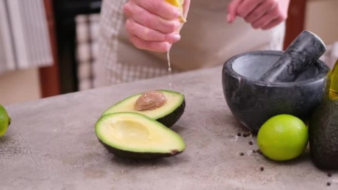 guacamole ingredients - Avocados whole and cut on 