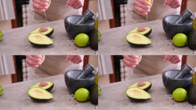 guacamole ingredients - Avocados whole and cut on 