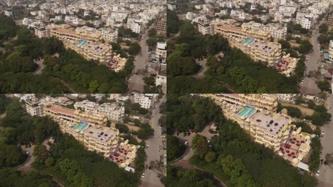 Aerial view of a resort with a pool on the rooftop