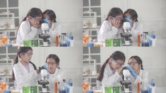 快乐的小学生在进行科学实验时会预料到化学反应