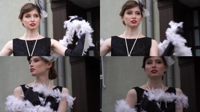 缓慢的运动。一个女人在镜头前跑下楼梯。一个年轻的女孩，穿着XX世纪20-30年代的黑色连衣裙，带着一