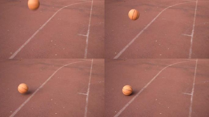 空旷的室外红街球场上的篮球跳跃