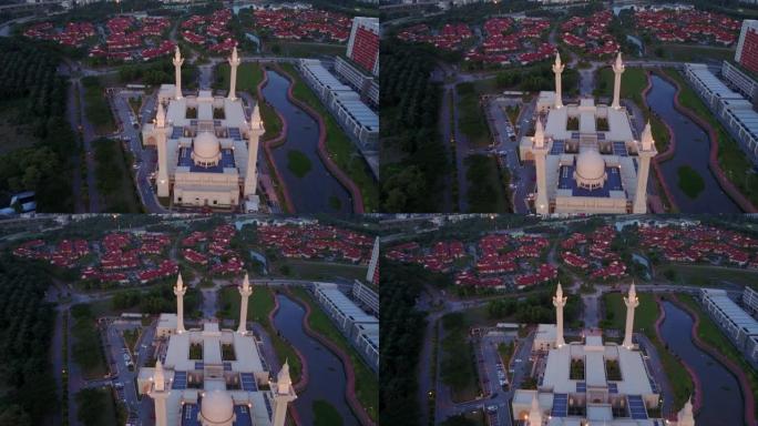 日落时马来西亚武吉耶路通雄伟的东姑安普安热马清真寺的鸟瞰图