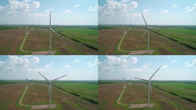 田间风车农场的鸟瞰图。世界能源电力危机。绿色能源生产理念。产生清洁可再生能源的风力涡轮机。