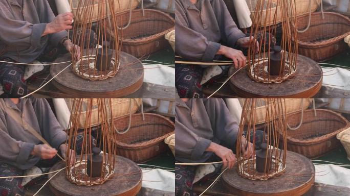 中世纪时代的女篮编织大师编织篮子。