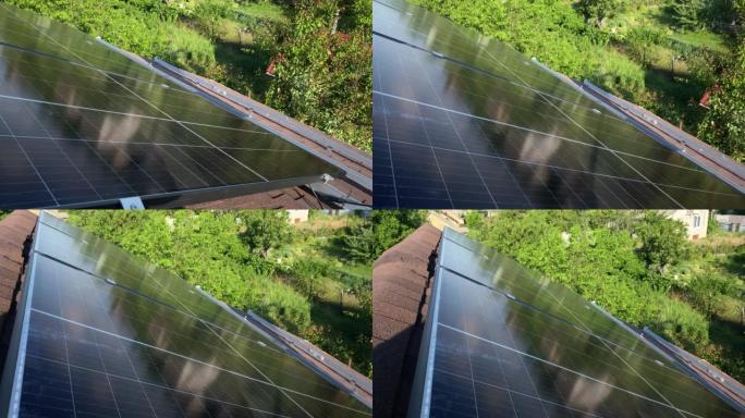光伏太阳能电池板在小房子沥青瓦屋顶上的安装地点。清洁绿色可再生能源DIY