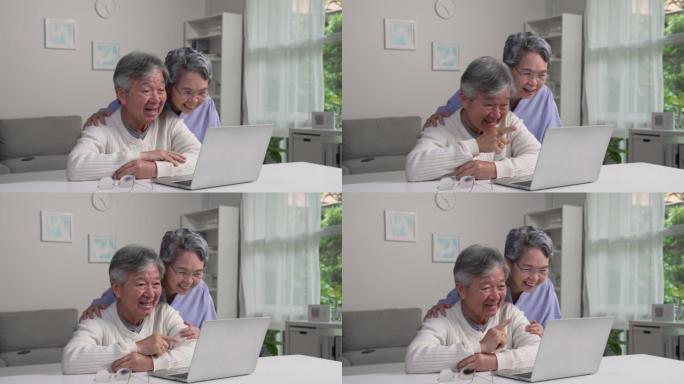 亚洲老年夫妇使用笔记本电脑进行视频通话会见朋友和家人。