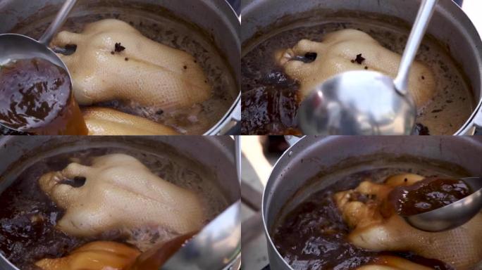 在不锈钢锅中烹饪锅炖鸭，传统锅炖鸭