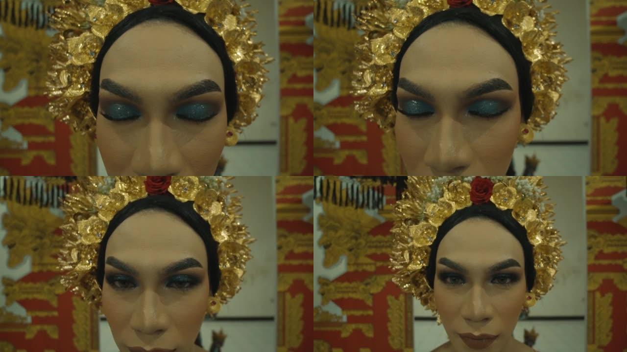 祈祷期间化妆和戴金冠的巴厘岛妇女的特写脸