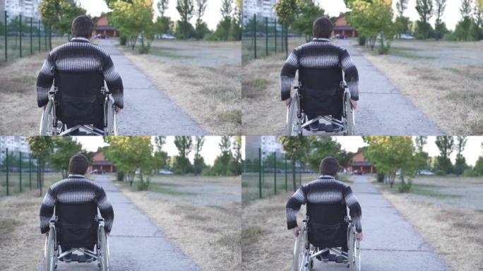 一个残疾人在公园散步