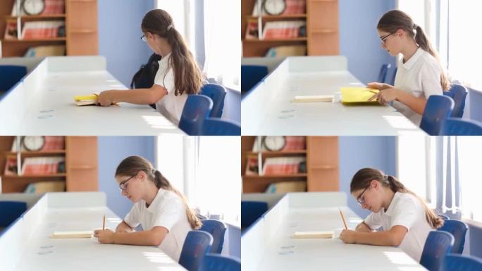 学生进入教室，坐在椅子上，用铅笔在笔记本上写字。