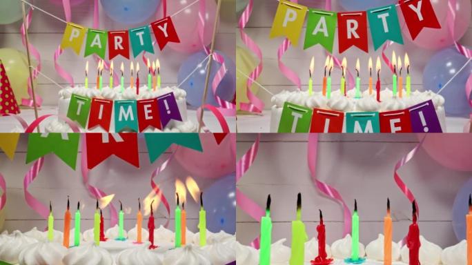 气球和丝带背景上的生日蛋糕上的蜡烛。