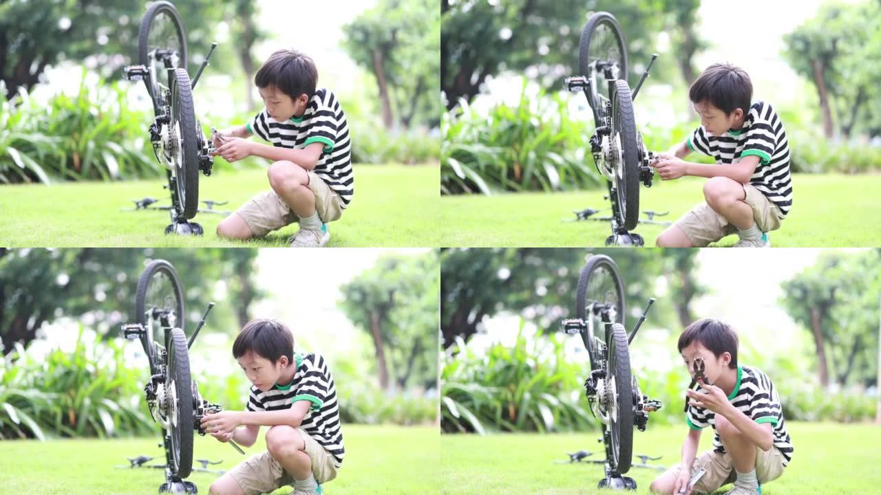 男孩修理自行车小男孩修自行车视频素材