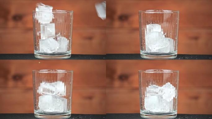 冰与鸡尾酒一起落入玻璃杯中冷却饮料