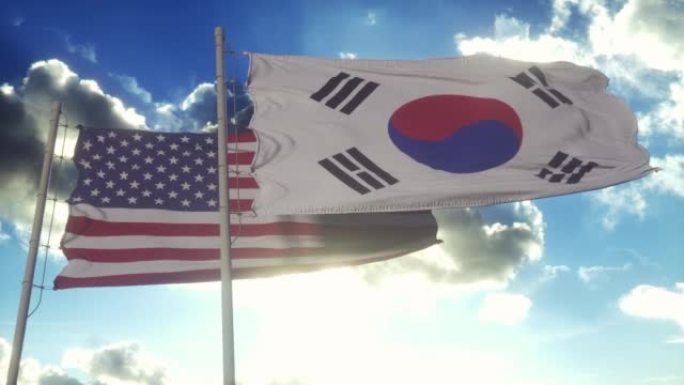 旗杆上挂着韩国和美国的国旗。韩国和美国在风中挥舞着国旗。韩美外交概念