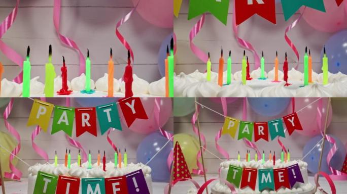 气球和丝带背景上的蜡烛生日蛋糕。