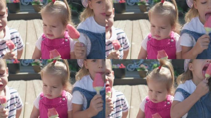 Three cute little Children enjoys delicious ice cr