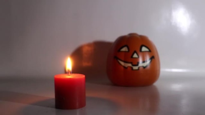 Halloween candles and pumpkins on white background