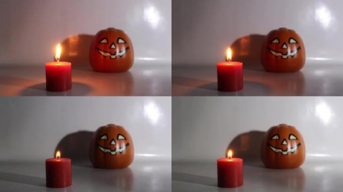 Halloween candles and pumpkins on white background