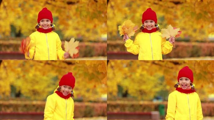 一个笑容灿烂的女孩正在秋天的公园里玩黄叶。