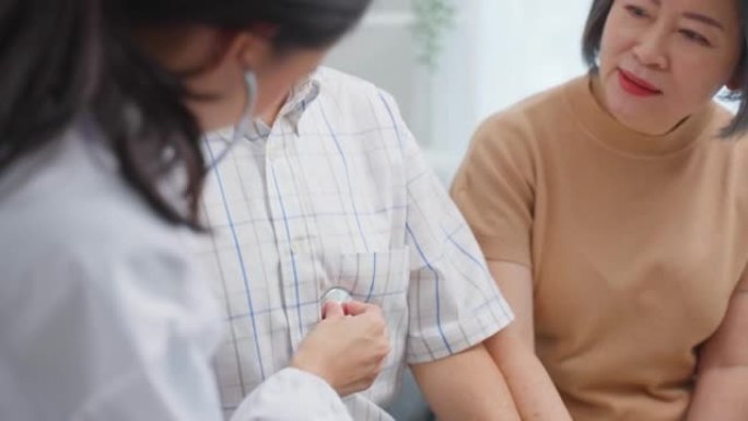 Asian caregiver nurse examine senior male patient 