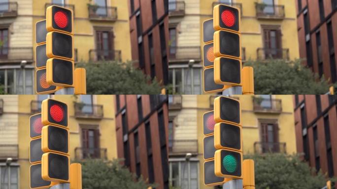 西班牙巴塞罗那人行横道上的黄色街道交通灯改变颜色