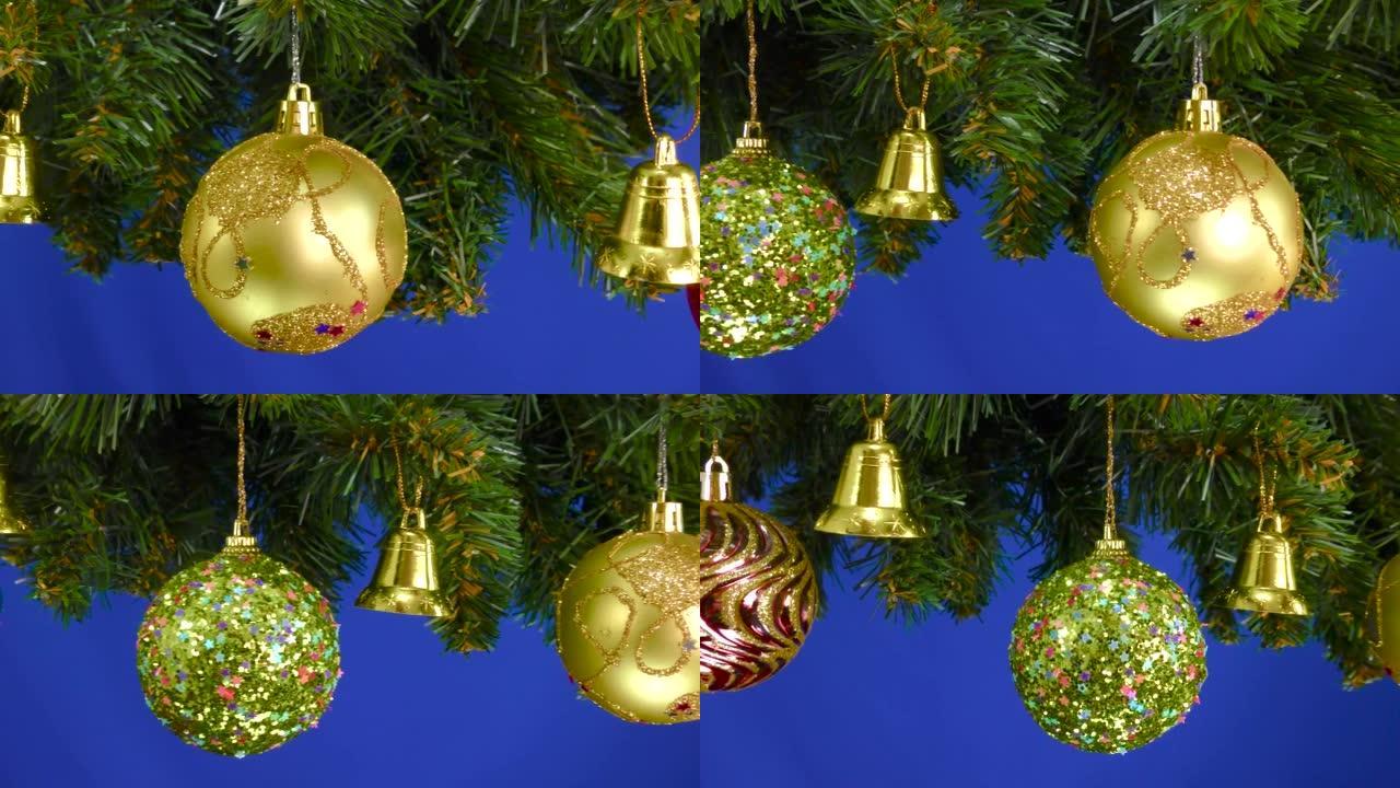 装饰有圣诞装饰品的圣诞树树枝在蓝色背景上旋转