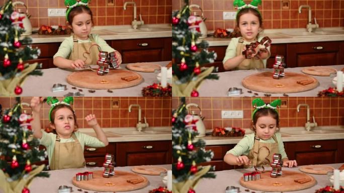 圣诞快乐。节日快乐。家庭准备节日食品。可爱的小女孩准备做圣诞饼干