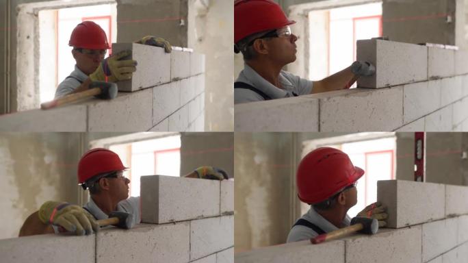 瓦工或泥瓦工砌砖以建造蒸压加气混凝土砌块的墙。砖砌工人承包商用泡沫混凝土建造砌块，用激光水平进行精确