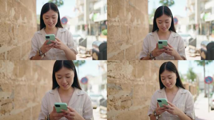 Chinese woman smiling confident using smartphone a