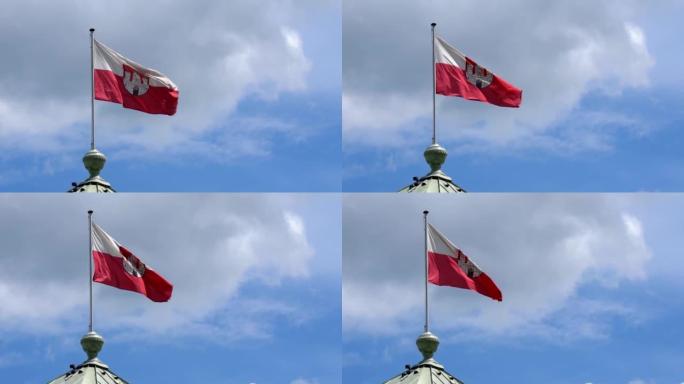 萨尔茨堡的旗帜在湛蓝多云的天空中飘扬