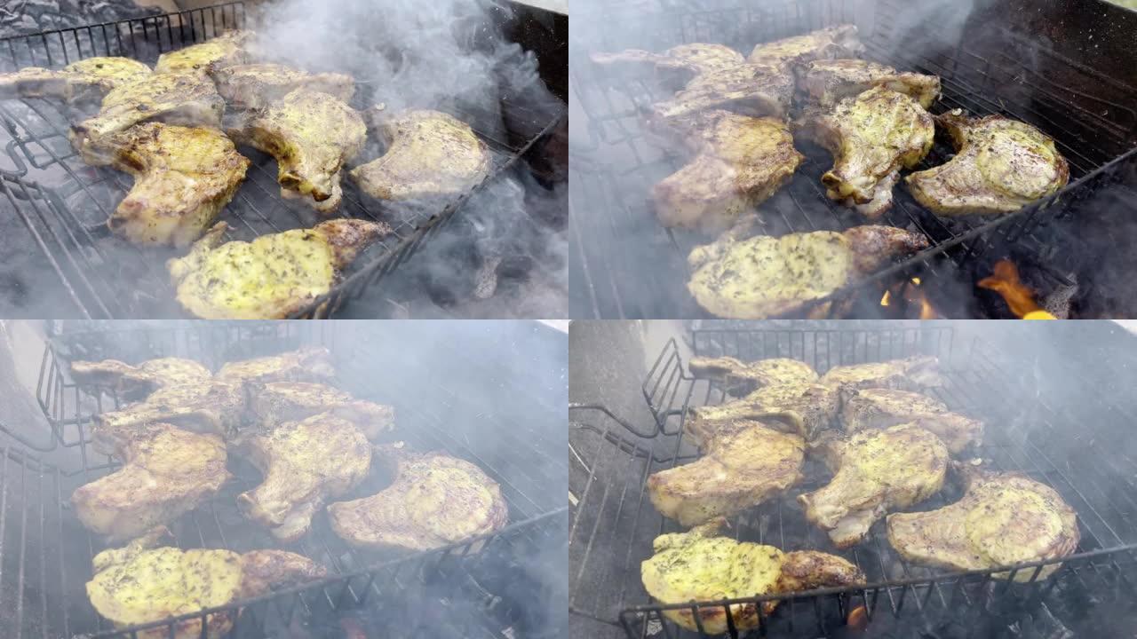 煮熟的多汁牛排肉牛肉用迷迭香刷在燃烧的烤架上，周围有其他肉。慢动作
