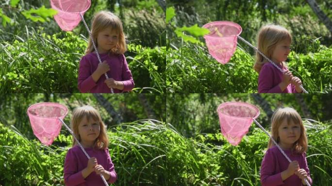 可爱的小女孩，用粉红色的勺子网狩猎虫子和蝴蝶