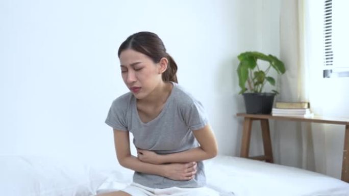 亚洲妇女患有严重的腹痛，反酸，胃炎，食物中毒，阑尾炎，月经疼痛。