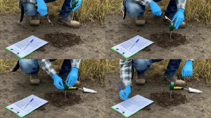 专业农民使用户外土壤测试仪测量土壤特征