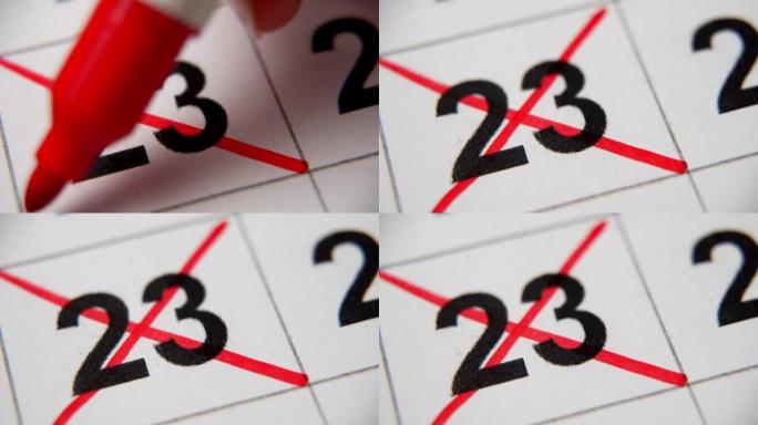 日历中的第23个数字在白纸上的宏中用红叉划掉。计划、笔记、会议日历。商业日历。日历中注释的标记。