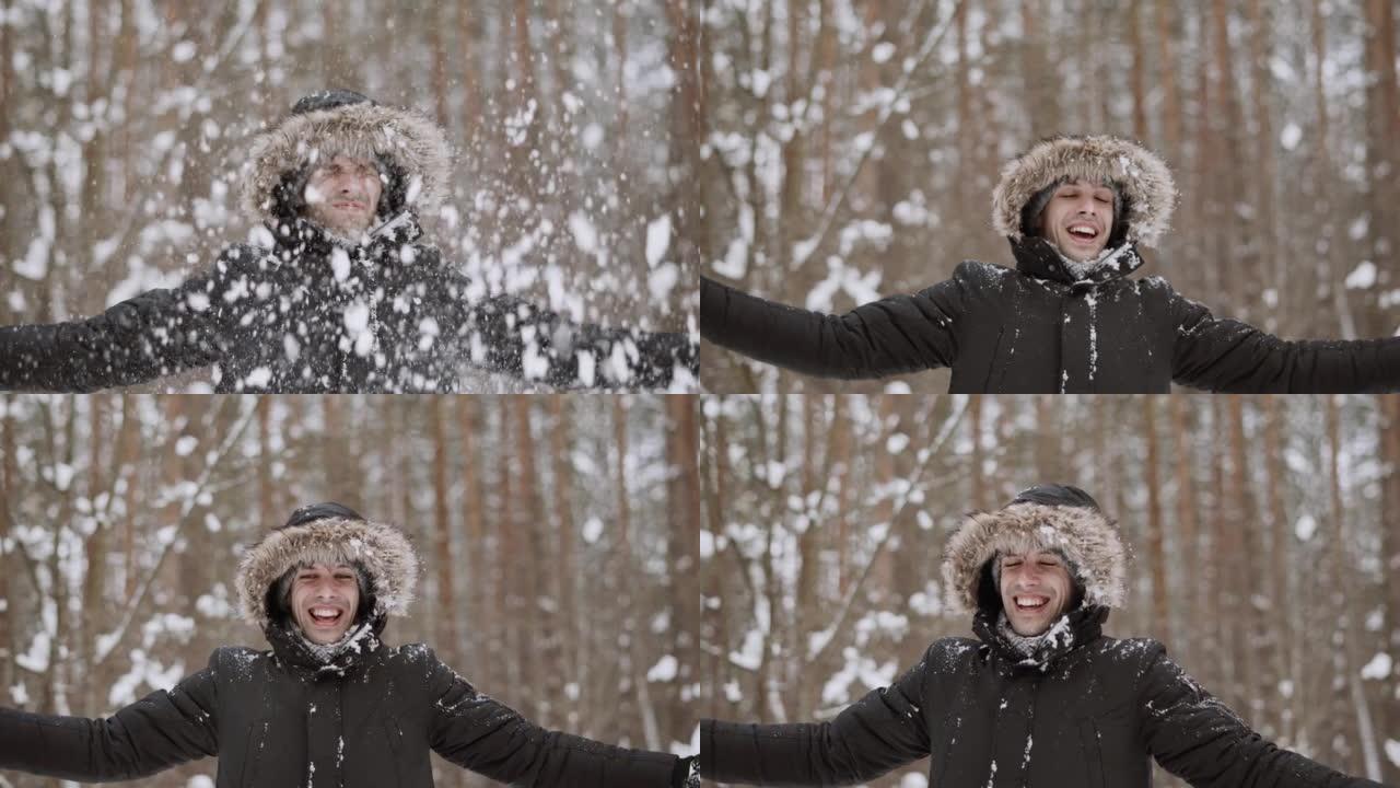 冬季森林中的人的肖像。那家伙扔雪球，巴掌，雪蝇。