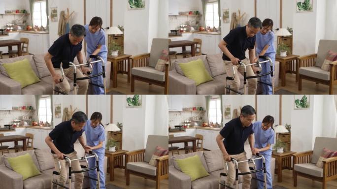亚洲女性护理助手帮助受伤的退休男性从家里的沙发上慢慢站起来时使用助行器。老年人居家保健理念