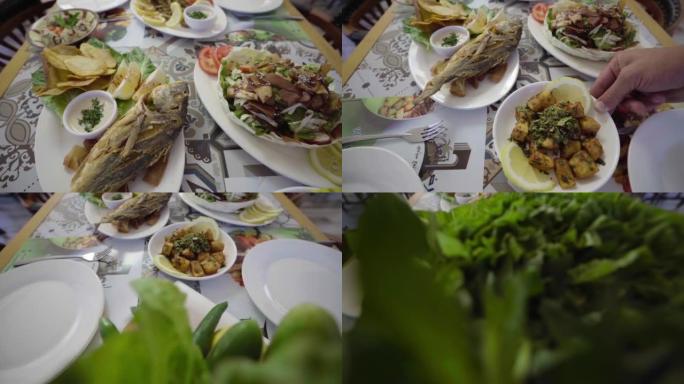 提供一盘鲷鱼和各种黎巴嫩美食开胃菜