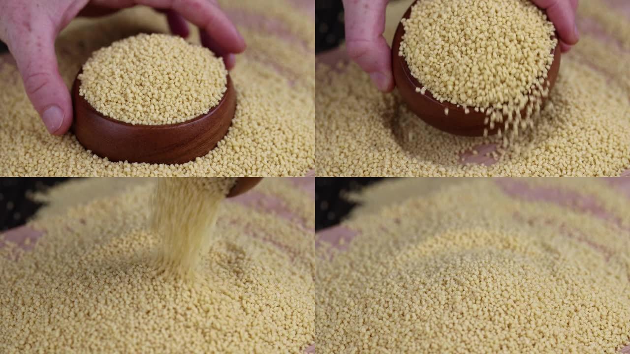 从小麦或小米中撒上蒸粗麦粉