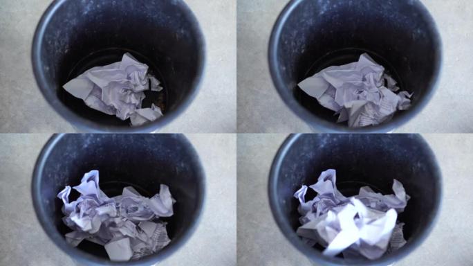 特写镜头把纸扔进垃圾桶。