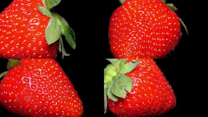 黑色背景上的新鲜草莓特写，细节