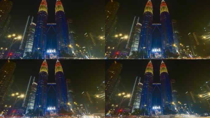 马来西亚国家石油公司双塔大厦在独立日和红绿灯道期间拍摄的带有马来西亚国旗颜色的延时4k UHD镜头
