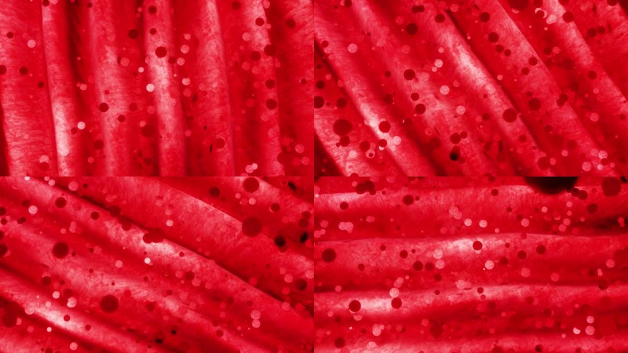 红色丝布和颗粒，红色波缎织物环背景。
