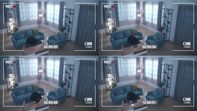 监视器的屏幕记录了一个小偷拿着手电筒在某人的房子里偷桌子下的盒子
