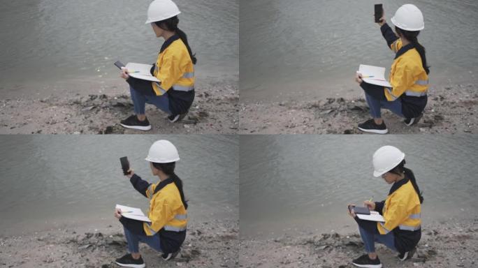 生态学家检查河水状况。
