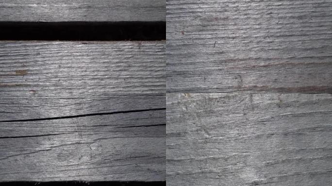 多莉拍摄了一块旧灰色木板的表面。木制表面的宏观幻灯片。