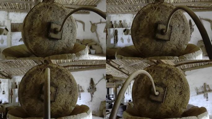 意大利西西里岛Grotta Mangiapane乡村的牛，马或磨石拉动的老式橄榄油压榨机的详细信息