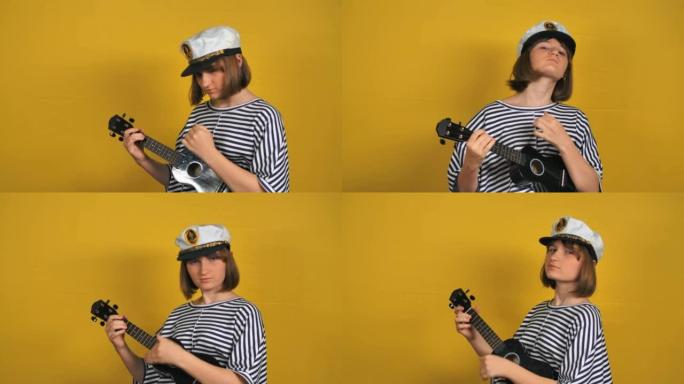穿着水手帽的年轻漂亮金发女孩在工作室里弹四弦琴吉他